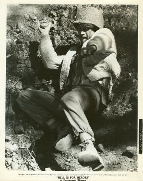 Reese (McQueen) throwing hand grenade.